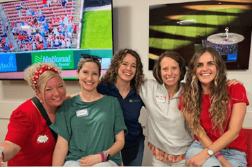 5 women from our PritikinLIVE team pose smiling together in one of the Party Stadiums at Busch Stadium