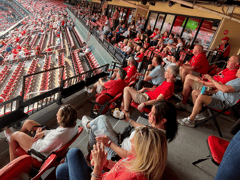 The outdoor section of our Party Suite where  a number of our employees are sitting and watching the game.