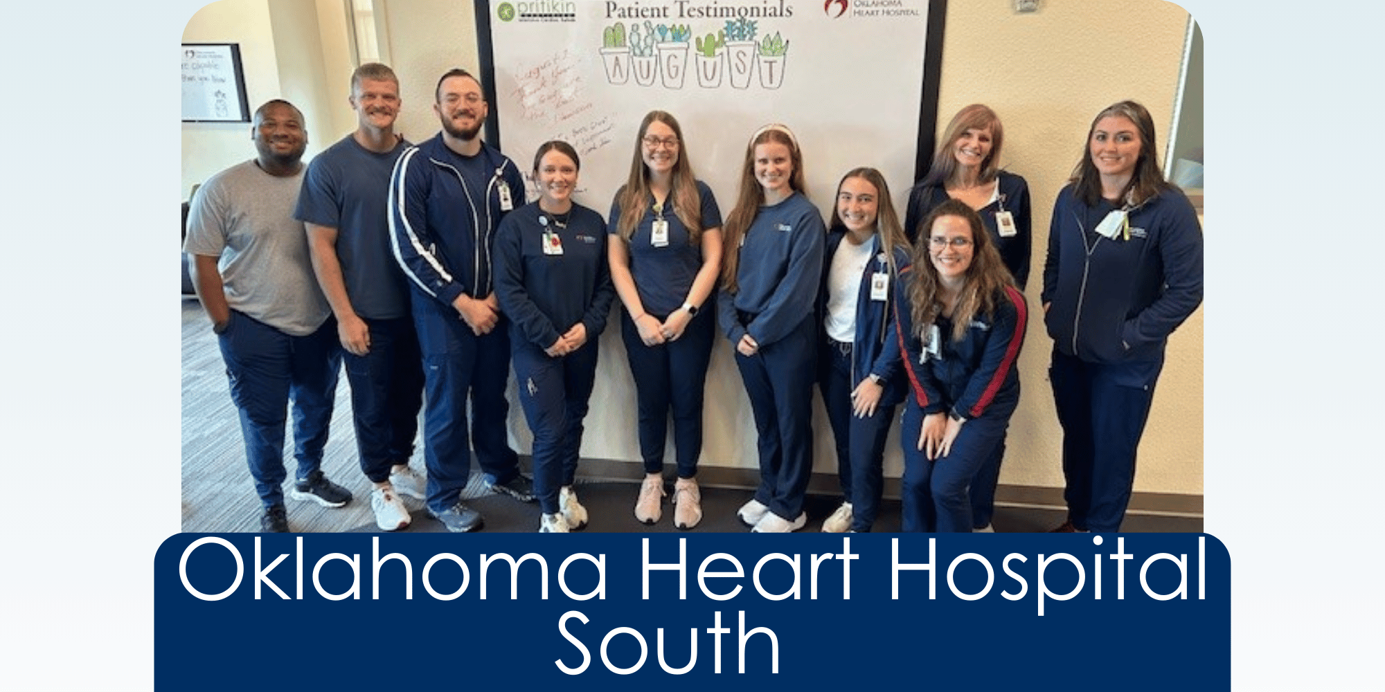 a group of 9 Oklahoma Heart Hospital cardiac rehab employees stand just below a white board that has hand written patient testimonials on it. All are looking at the camera